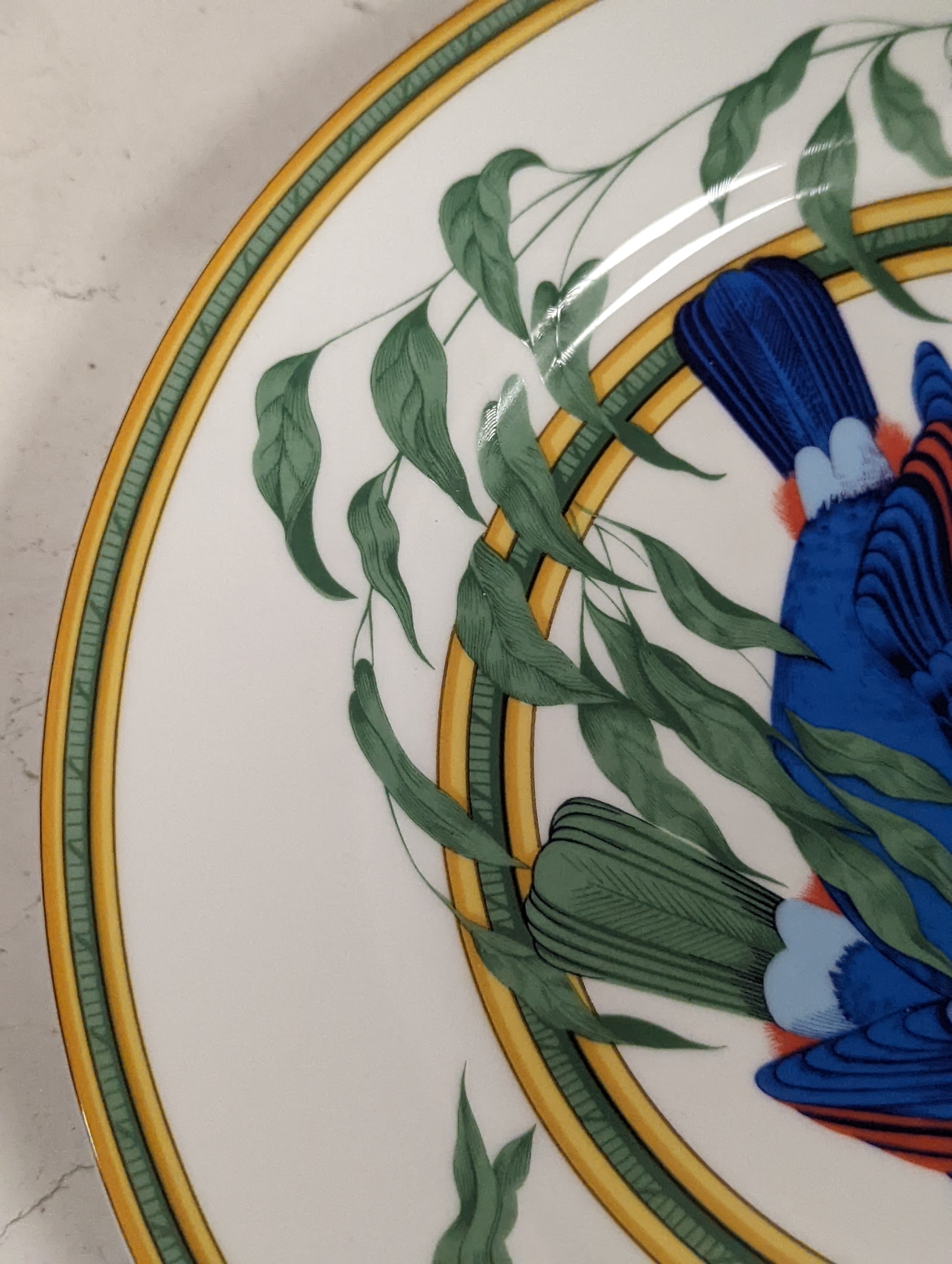 A pair of Hermes, Paris 'Toucan' plates, diameter 27.5cm, edge blemishes